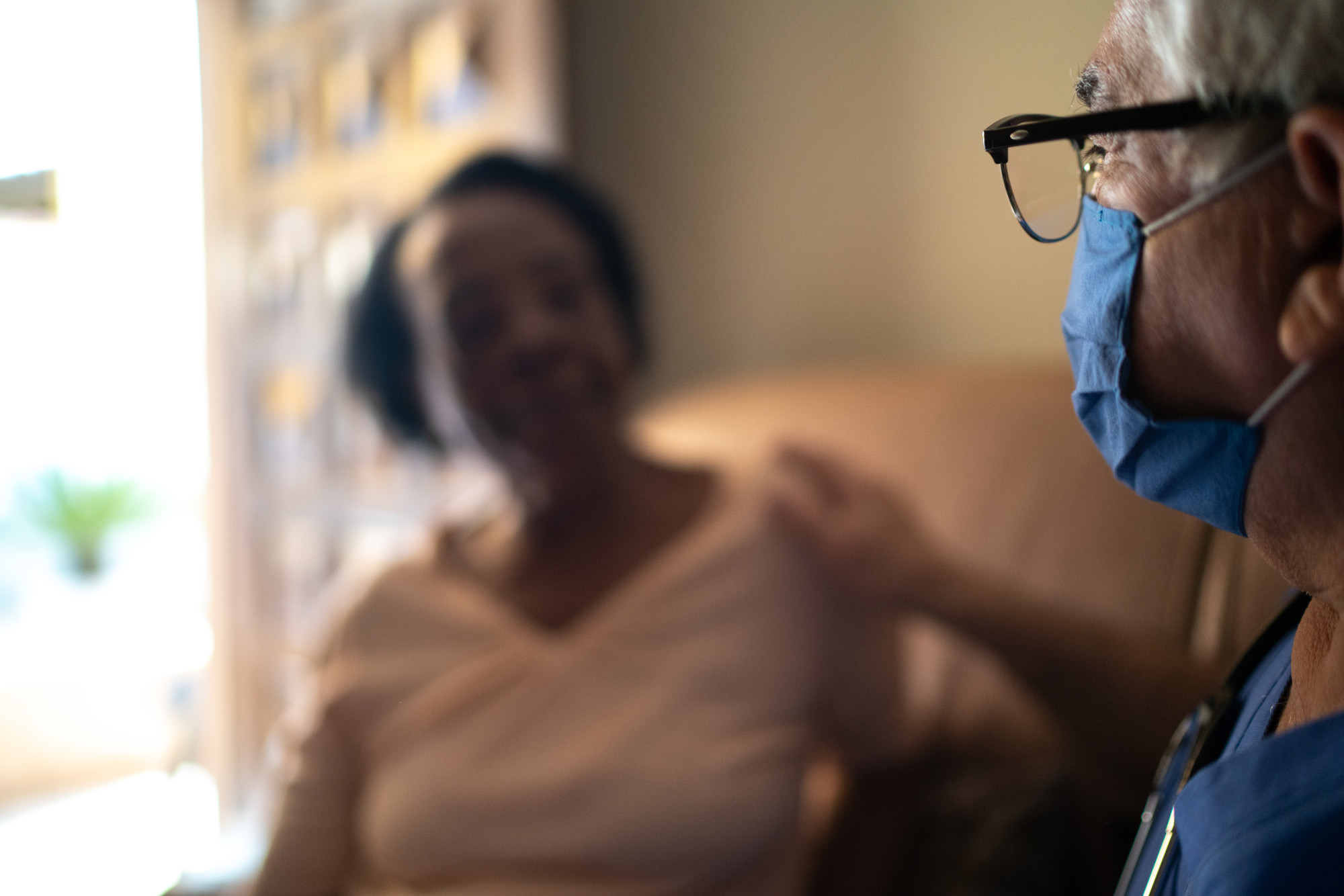 Health Visitor And A Senior Woman During Home Visit Maryland 